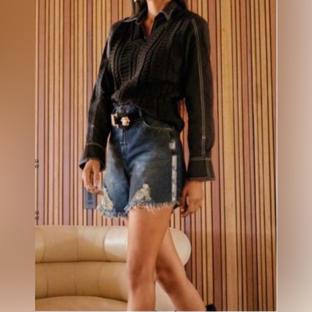 Jean shorts with black line.